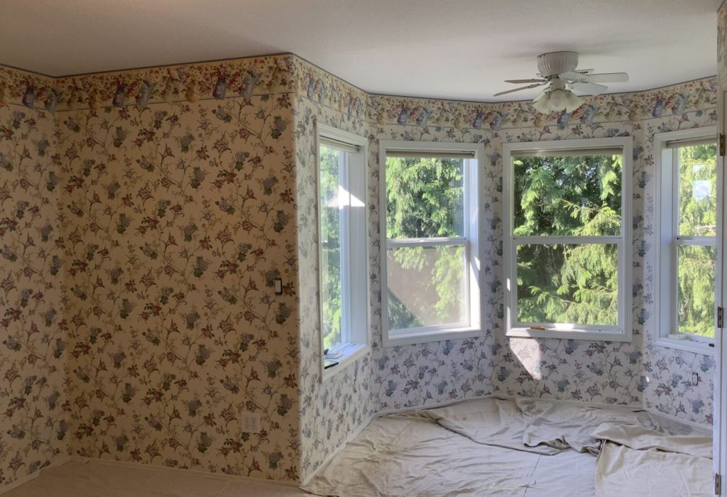 Interior room after painting with freshly painted walls and ceiling.